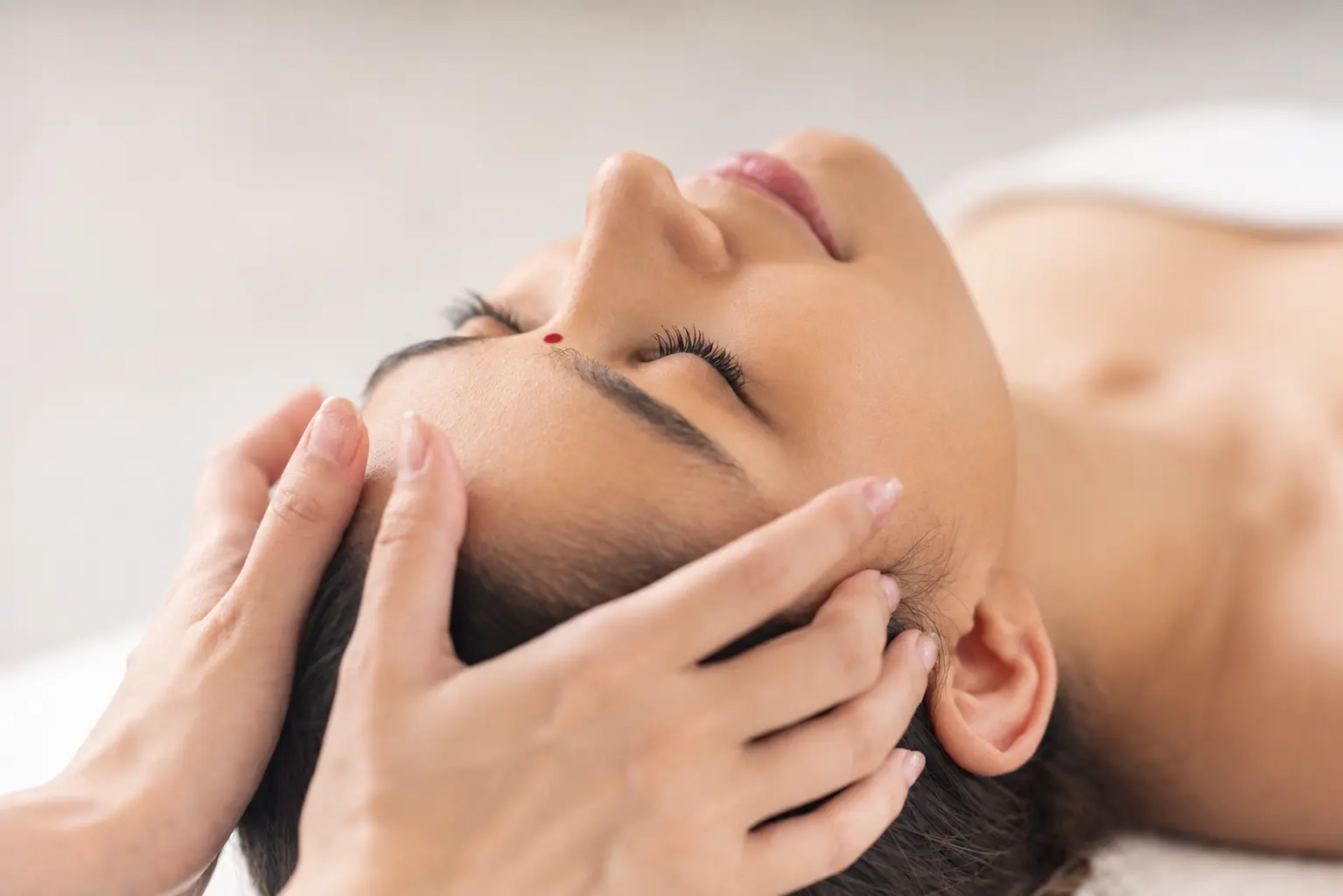 Gentle Access Bars healing session — practitioner touching head points for energy reset